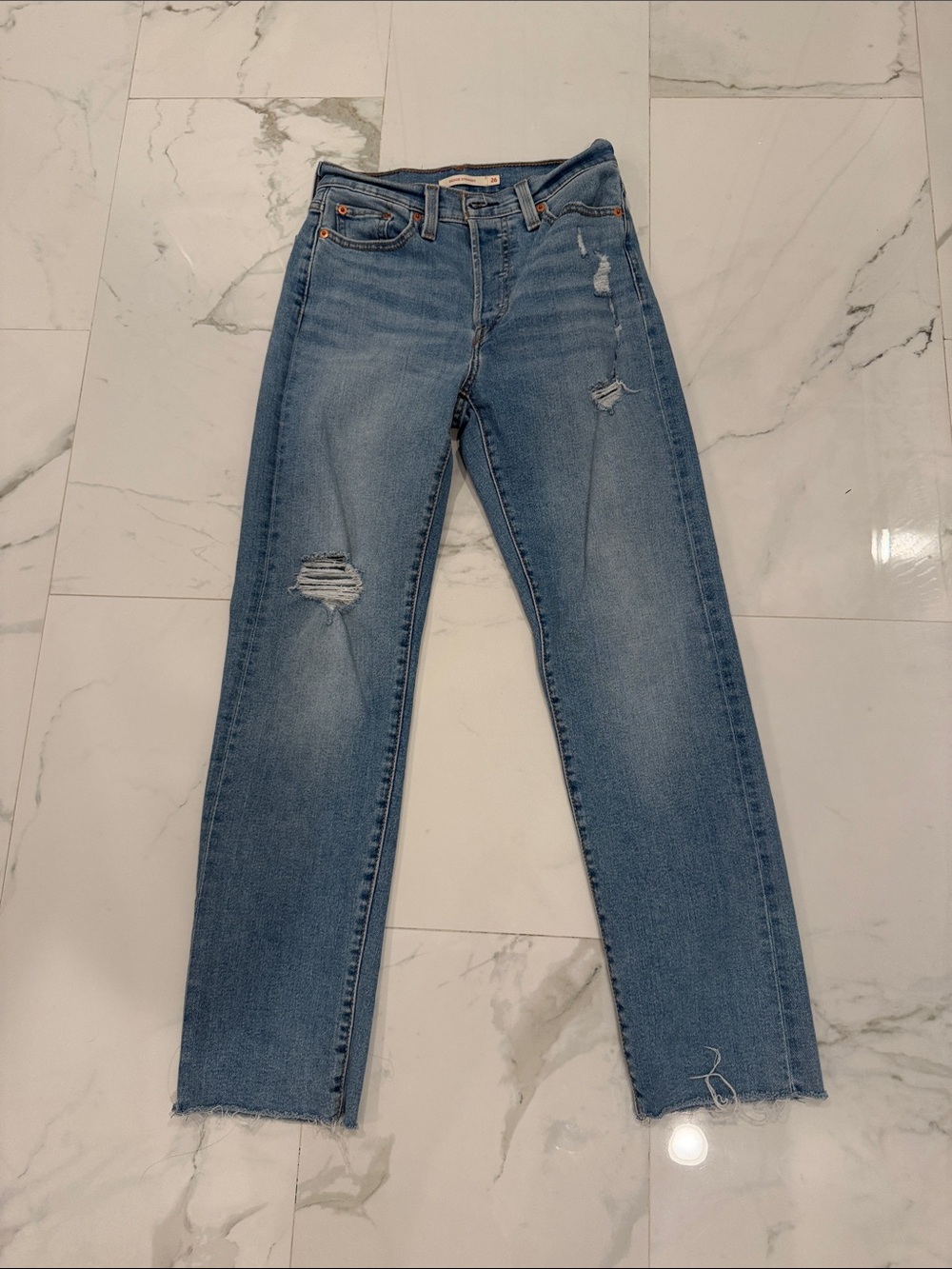 Levi’s Women’s Light Blue Distressed Straight Jeans